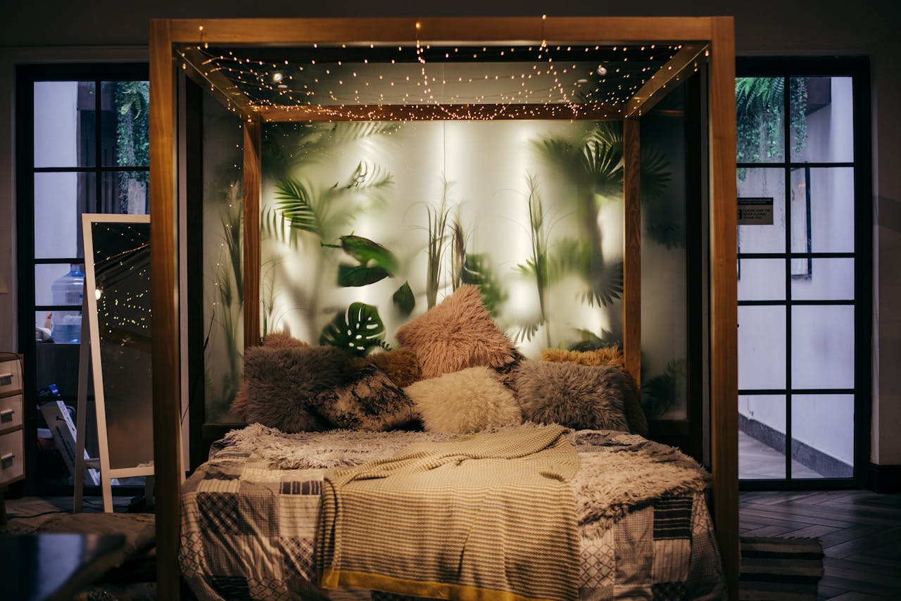 About Luxurious modern bedroom with plants and string lights, creating a cozy ambiance.